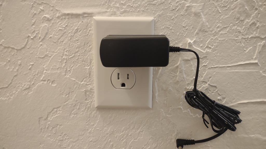 AeroGarden Harvest power plug plugged into wall outlet