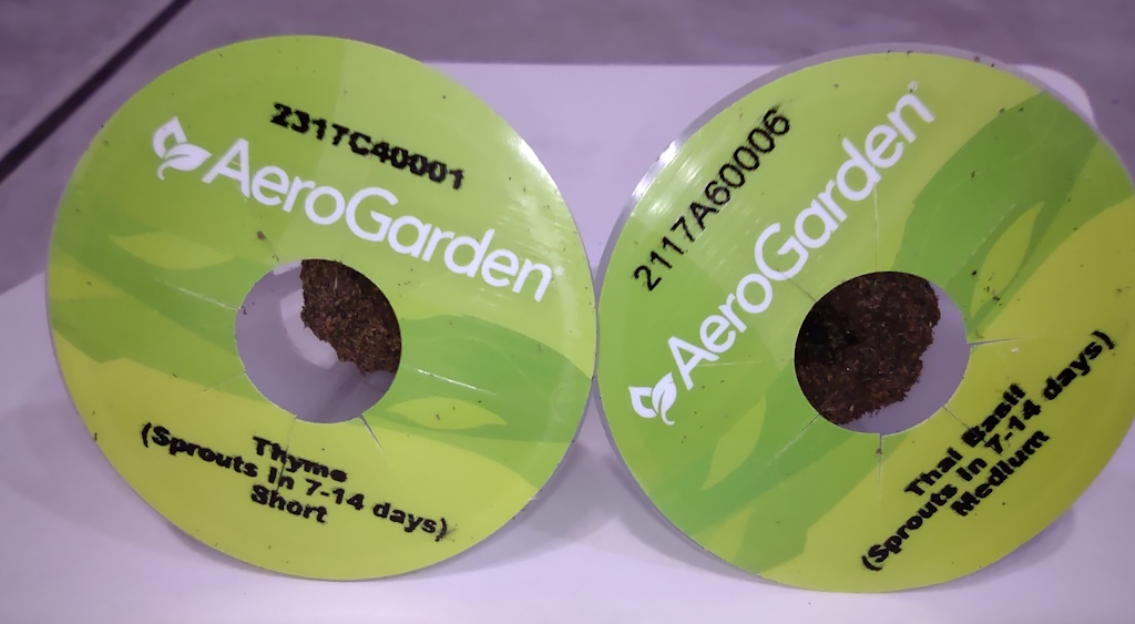 Two AeroGarden grow plugs with tops visible