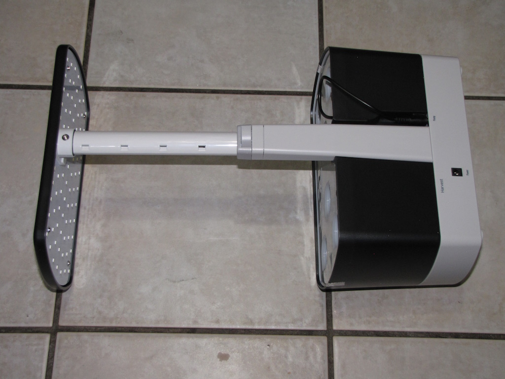 AeroGarden Harvest laying face-down with light assembly fully extended