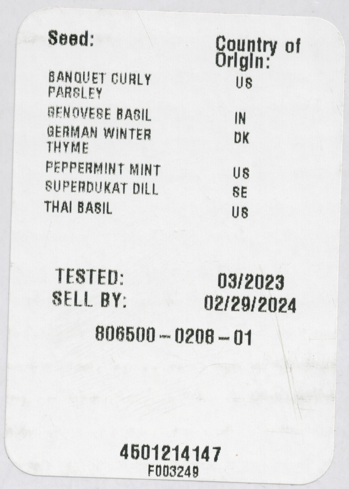 Close-up view of the disclosure of seed origins and sell by date from bottom of AeroGarden Harvest box