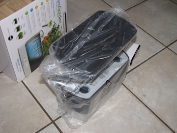 AeroGarden Harvest still wrapped in plastic after being removed from box