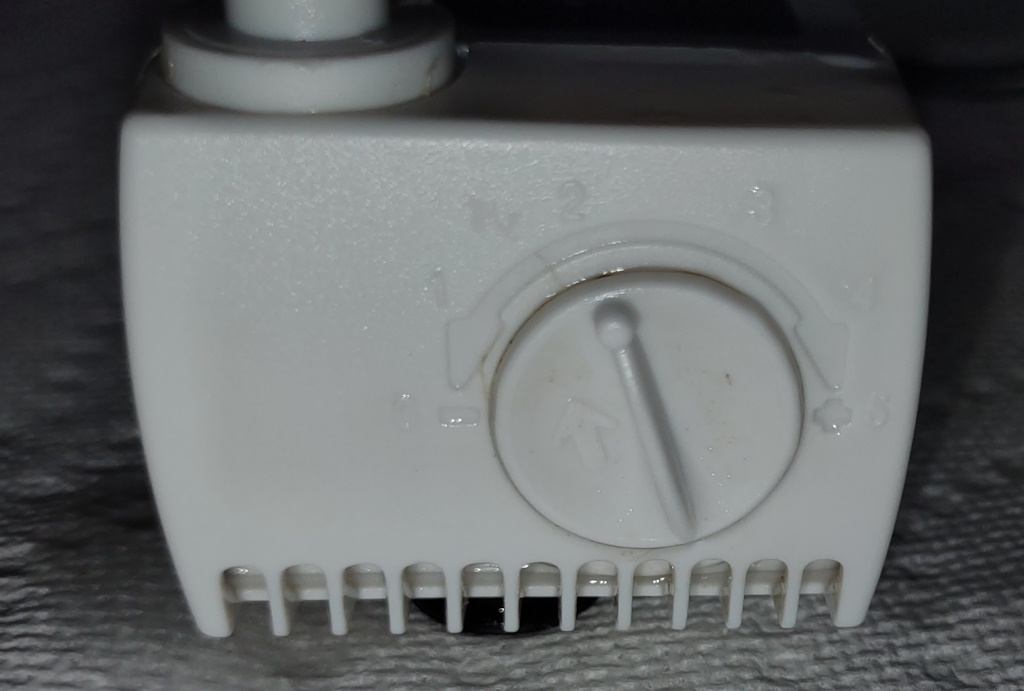 Close-up view of the pressure control dial on the AeroGarden Harvest water pump